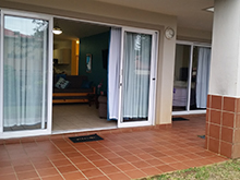Modern, spacious 2 bedrooms, 2 bathroom ground floor unit close to all amenities, approximately 200 meters to main beach. Open plan lounge, dining room and kitchen (fully equipped with washing machine & tumble drier). 1st bathroom (tub), en-suite bathroom (shower). Patio, communal braai and pool area available. Under cover parking + visitors parking available with 24 hour security surveillance. (Sleeps 6).