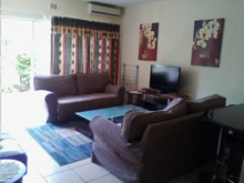 Modern, air conditioned spacious fully furnished self catering 2 bedroom, 1.5 bathroom unit in secure complex.Open plan lounge kitchen, which opens up onto a large patio with built in braai. Short walk to the beach and shops. Dstv connections (bring own decoder / card / cables) (Sleeps 6)
