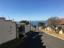Ideal for either extended families, or income generator. Close to shops and the ocean. 4 x units, 2 upstairs and 2 downstairs all consisting of 2 bedrooms, 1 bathroom, kitchen, open plan lounge dining area with enclosed balcony with sea views. lovely spacious garden well maintained, 4 single lock up garages. Priced right at R2 400,000.00
